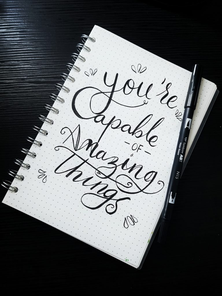 pen on you're capable of amazing things spiral notebook