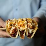tacos chicken beans tomato pepper cheese side view