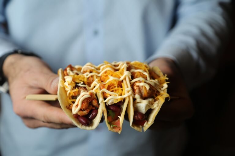 tacos chicken beans tomato pepper cheese side view